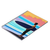 サンセットでサーファーがビーチに立つ ノートブック (左側)