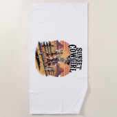 サンセット女性のカーボーイスケルトンライディングホース ビーチタオル (正面)