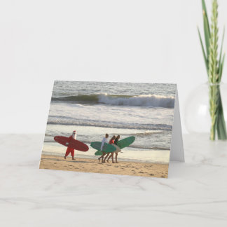 サンタおよびサーファーの女の子の中の挨拶 シーズンカード