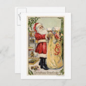 サンタがあふれ出るおもちゃのバッグを保持 シーズンポストカード (正面/裏面)