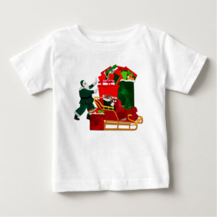 サンタがそりを詰めるTシャツ ベビーTシャツ