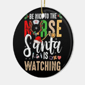 サンタがクリスマスを見ているナースに優しい セラミックオーナメント (左)