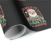 サンタがクリスマスを見ているナースに優しい ラッピングペーパー (ロールコーナー)