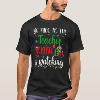サンタがクリスマスを見ている先生に優しい Tシャツ