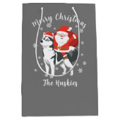 サンタがハスキー犬に酔ってクリスマスを楽しむ ミディアムペーパーバッグ (正面)