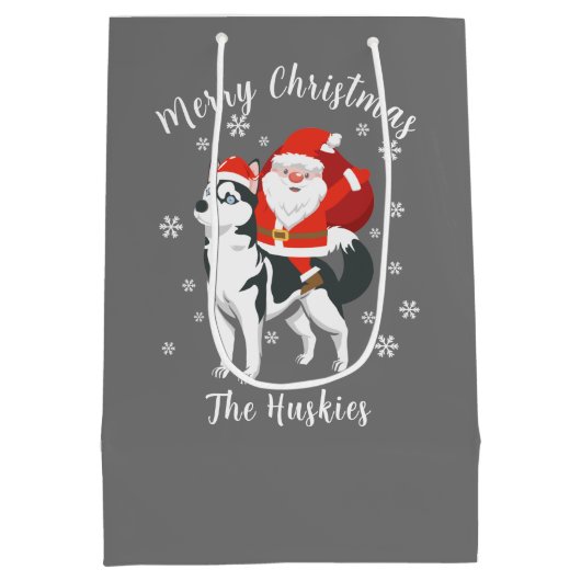サンタがハスキー犬に酔ってクリスマスを楽しむ ミディアムペーパーバッグ (裏面)