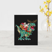 サンタが恐竜のT-Rexと鹿に乗る子供たち、少年、男性のクリスマス カード (黄色い花)