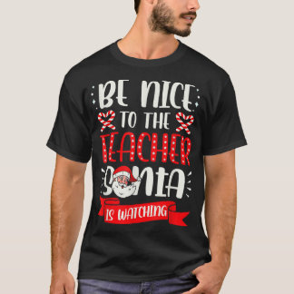 サンタが醜い先生を見ている親切に Tシャツ