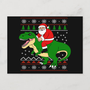 サンタがTレックスに乗るクリスマス恐竜アグリークリスマス シーズンポストカード