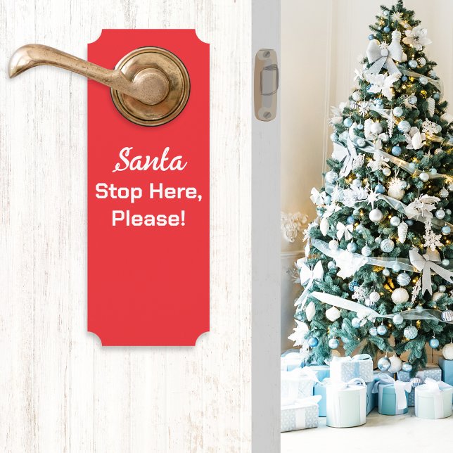 サンタさんここで止まって 赤 ドアノブサイン (A red Christmas door handle hanger with message 'Santa Stop Here, Please!' in white typography)