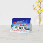 サンタそりで楽しいクリスマスペンギンの家族 カード (黄色い花)