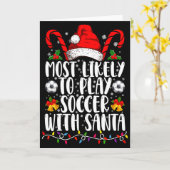 サンタとサッカーする家族のクリスマス カード (黄色い花)