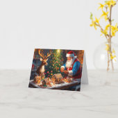 サンタとトナカイがジンジャーブレッドハウスを作る カード (黄色い花)