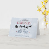 サンタと彼のトナカイ飛んでいるシルエットクリスマス カード (黄色い花)