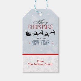 サンタと彼のトナカイ飛んでいるシルエットクリスマス ギフトタグ