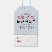 サンタと彼のトナカイ飛んでいるシルエットクリスマス ギフトタグ (正面)