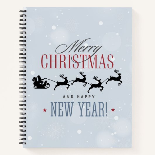 サンタと彼のトナカイ飛んでいるシルエットクリスマス ノートブック (正面)