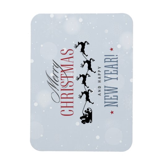 サンタと彼のトナカイ飛んでいるシルエットクリスマス マグネット (縦)