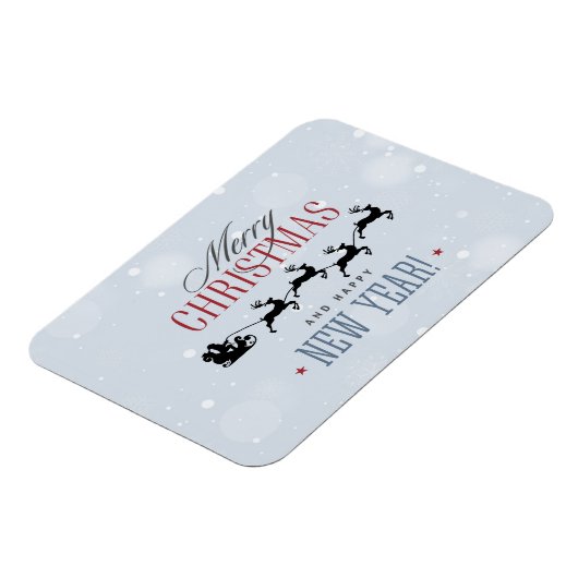 サンタと彼のトナカイ飛んでいるシルエットクリスマス マグネット (左側)