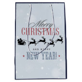 サンタと彼のトナカイ飛んでいるシルエットクリスマス ミディアムペーパーバッグ (正面)