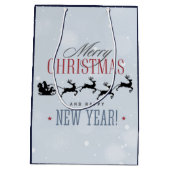 サンタと彼のトナカイ飛んでいるシルエットクリスマス ミディアムペーパーバッグ (裏面)