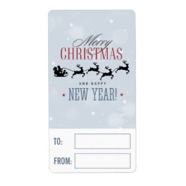サンタと彼のトナカイ飛んでいるシルエットクリスマス ラベル