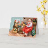 サンタと彼の小人が工作室で作業中 カード (黄色い花)