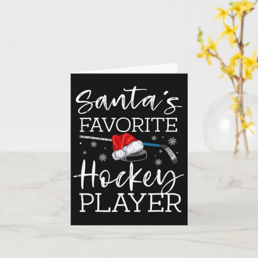 サンタのお気に入りのホッケー選手の楽しいパジャマクリスマス カード (黄色い花)