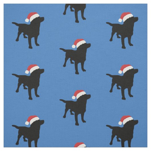 サンタのクリスマスの帽子を身に着けている黒い実験室犬 ファブリック (見本)