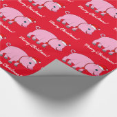 サンタの帽子および弓を持つブタ ラッピングペーパー (角)