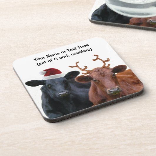 サンタの帽子および(雄ジカの)枝角のクリスマスの休日牛 コースター (左側)