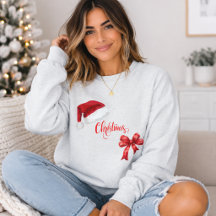 サンタの帽子と赤いリボングラフィックの女性用クリスマスTシャツ