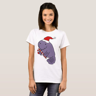 サンタの帽子のクリスマスの漫画のおもしろいなマナティー Tシャツ