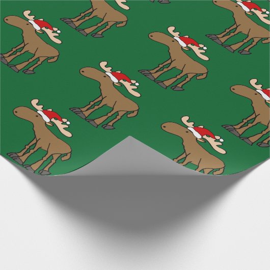 サンタの帽子のクリスマスの漫画を身に着けているおもしろいなアメリカヘラジカ ラッピングペーパー (角)