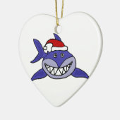 サンタの帽子のクリスマスの芸術を身に着けている微笑の鮫 セラミックオーナメント (左)