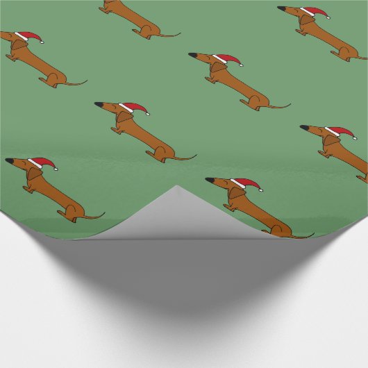 サンタの帽子のクリスマスの覆いのおもしろいなダックスフント犬 ラッピングペーパー (角)