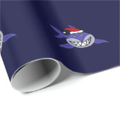 サンタの帽子のクリスマスの覆いを身に着けているおもしろいな鮫 ラッピングペーパー (ロールコーナー)