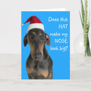 サンタの帽子のクリスマスカードが付いているおもしろい犬 シーズンカード