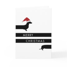 サンタの帽子の幸せな休日のおもしろいなダックスフント