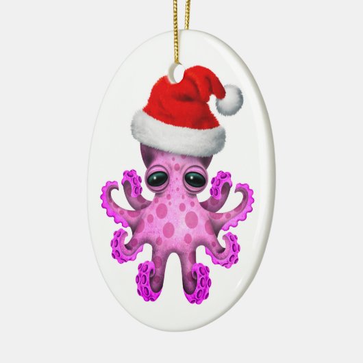 サンタの帽子の白を身に着けているかわいいピンクのベビーのタコ セラミックオーナメント (左)