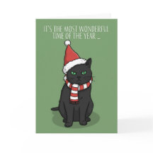 サンタの帽子をかぶったおもしろいおこりんぼ猫のメリークリスマス