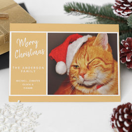 サンタの帽子をかぶったオレンジ色の猫の面白いクリスマス シーズンカード
