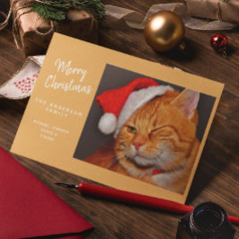 サンタの帽子をかぶったオレンジ色の猫の面白いクリスマス シーズンカード