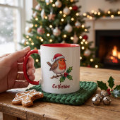 サンタの帽子をかぶったクリスマスのコマドリの名入れグッズ マグカップ