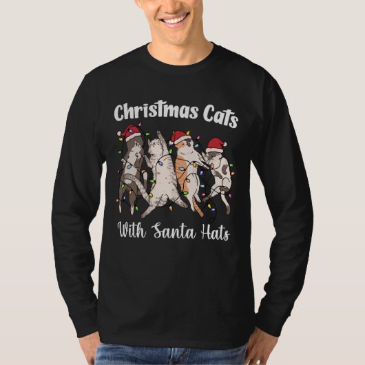 サンタの帽子をかぶったクリスマスの猫 かわいい面白い休日 Tシャツ (正面)