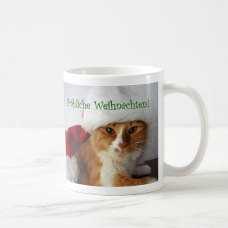 サンタの帽子をかぶったドイツの挨拶をする猫のマグカップ コーヒーマグカップ