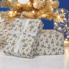 サンタの帽子をかぶった小さなソックモンキー タンギッシュなクリスマス ラッピングペーパー