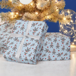 サンタの帽子をかぶった小さなソックモンキー 青いクリスマス ラッピングペーパー