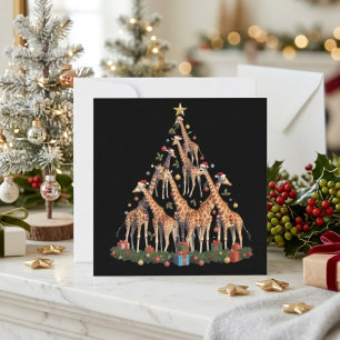 サンタの帽子をかぶった空想のキリンのクリスマスツリー シーズンカード