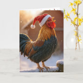 サンタの帽子をかぶった鳴き声をあげるクリスマスの雄鶏 カード (黄色い花)